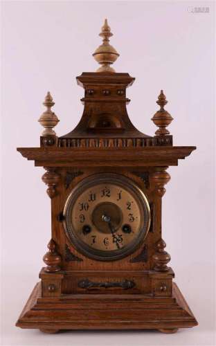 A table clock in an oak case, Germany 20th century.