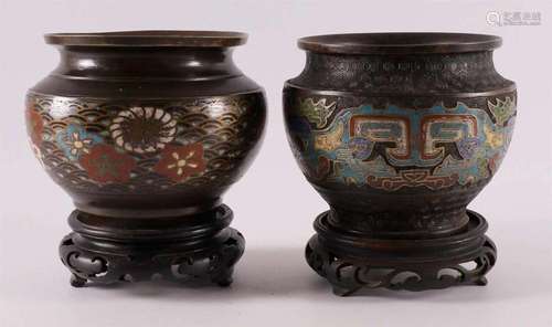 Two various cloissoné chache pots on a loose wooden base, ar...