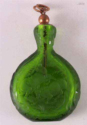 A green glass odeur falcon, Bohemia, 20th century.