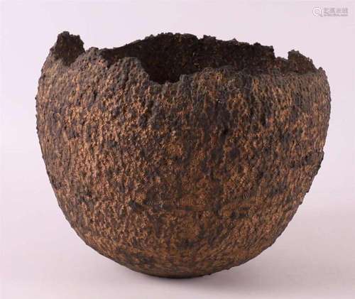 A brown/black serrated stoneware bowl decorated with pyrite ...