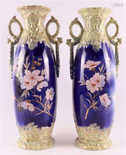 A pair of polychrome pottery ornamental vases with handles, ...