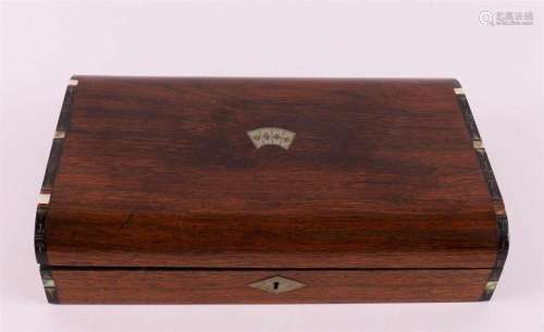 A mahogany playing card box with chips, England circa 1900.