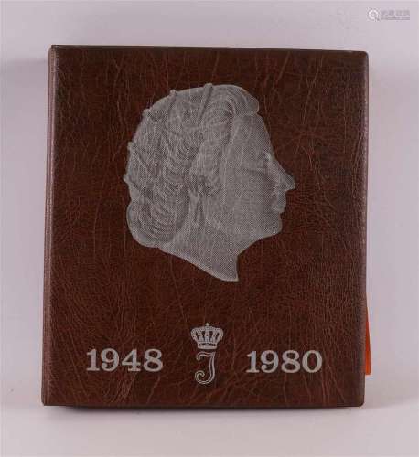 An album of Dutch coins, including silver guilders and Rijks...