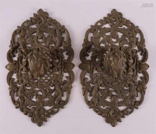 A pair of pierced brass horse head grilles, 20th century.