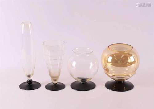 Four various Art Deco glass vases on black glass bases, ca. ...