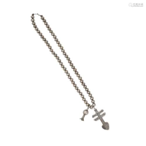 An Isleta cross necklace