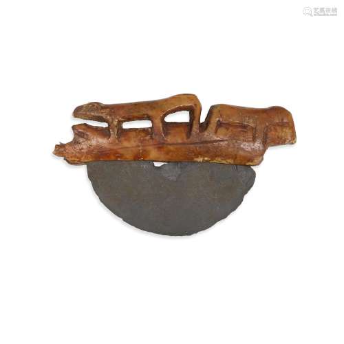 An ancient Eskimo ulu with figural handle