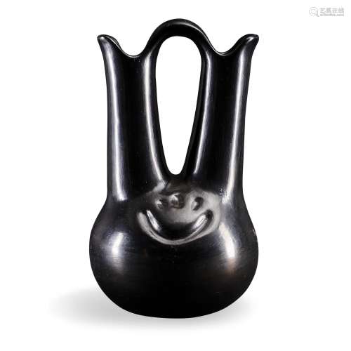 A Margaret Tafoya blackware wedding vase