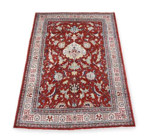 AN ISFAHAN CARPET, approximately 326 x 220cm