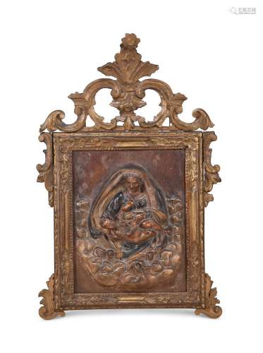 A GILT FRAMED, CARVED AND POLYCHROME PAINTED RELIGIOUS PANEL...