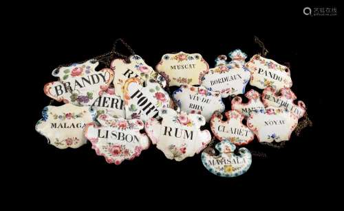 A GROUP OF SEVENTEEN ENAMELLED WINE AND LIQUOR LABELS, PREDO...