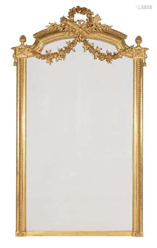 A LARGE CARVED GILTWOOD WALL MIRROR, IN LOUIS XVI STYLE, SEC...