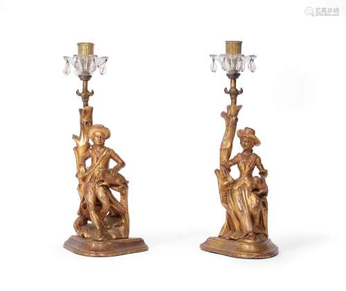 A PAIR OF CARVED GILTWOOD FIGURAL CANDLESTICKS, EARLY 19TH C...