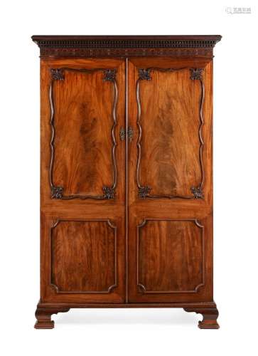 A GEORGE III MAHOGANY WARDROBE, IN THE MANNER OF THOMAS CHIP...