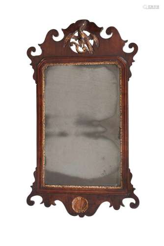 A GEORGE II MAHOGANY AND PARCEL GILT WALL MIRROR, MID 18TH C...