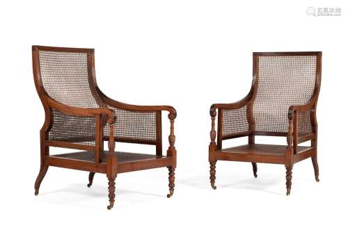 A PAIR OF REGENCY MAHOGANY AND CANED LIBRARY BERGERE ARMCHAI...
