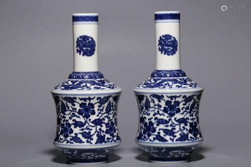 PAIR OF BLUE AND WHITE FLOWERS- INTERTWINING VASES