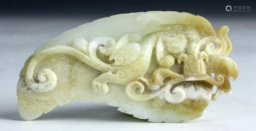 China, Antique jade piece featuring a curling dragon on unde...