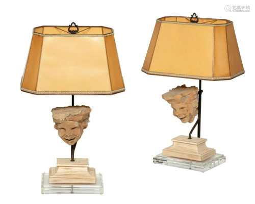 A pair of Continental earthenware mask lamps