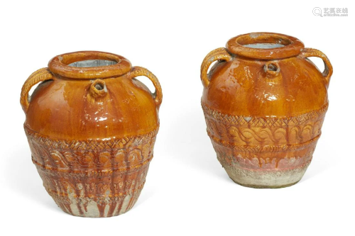 A pair of Continental glazed earthenware jars