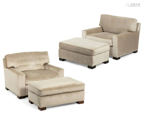 A pair of contemporary armchairs and ottomans