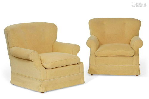 A pair of fully upholstered armchairs