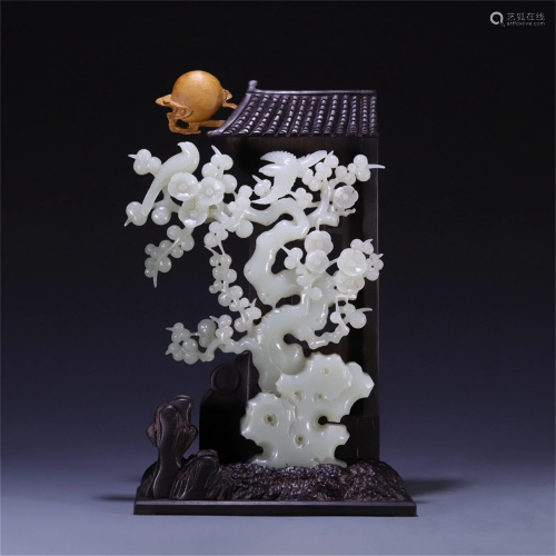 A Chinese Carved Jade Decoration with Wood Base