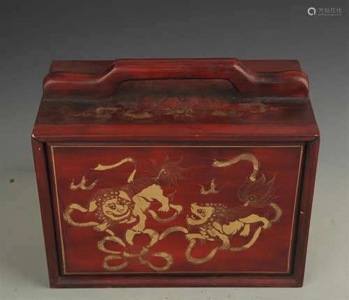 A GILT LACQUERED WOOD LION PLAYING LUNCH BOX