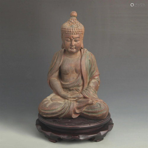 A FINE WOOD MADE GAUTAMA BUDDHA STATUE