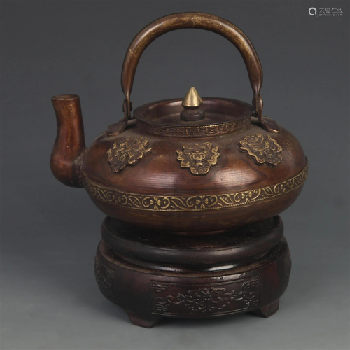 A FINE TIBETAN BUDDHIST FINELY CARVED BRONZE EWER