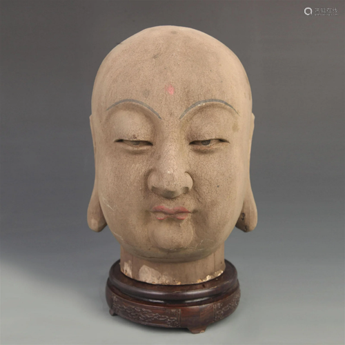 A FINELY PAINTED WOODEN BUDDHA HEAD FIGURE