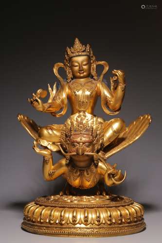A statue of a golden winged bird made of tathagata with bron...