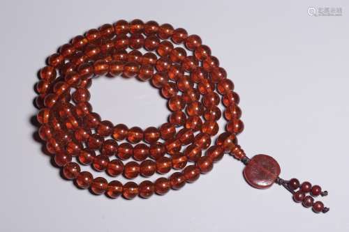 Amber 108 seeds holding rosary in Qing Dynasty