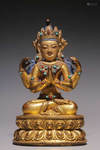 Qing Dynasty, bronze gilt inlaid treasure four-arm seated gu...