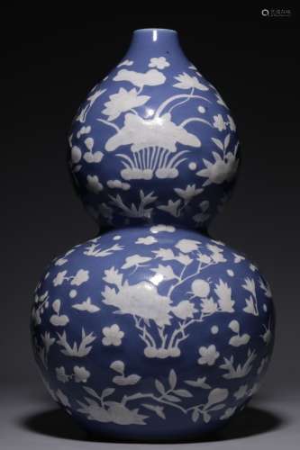Qing Dynasty, blue glaze pile white flower pattern gourd bot...