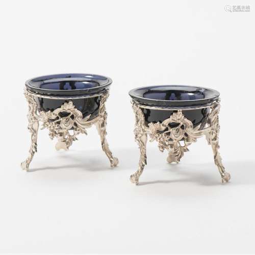 A PAIR OF DUTCH SILVER SALT-CELLARS AND BLUE GLASS LINERS MA...