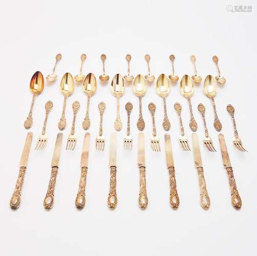 A FRENCH SILVER-GILT FLATWARE SERVICE MARK OF QUITTE PRUDENT...