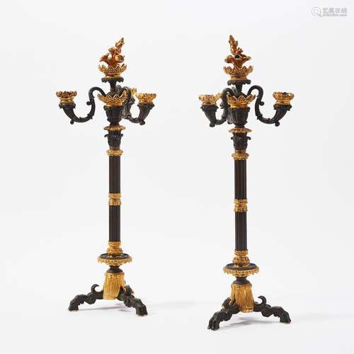 A PAIR OF PATINATED AND GILT BRONZE FOUR-LIGHT CANDELABRA PO...