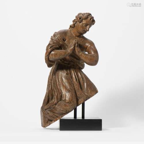 A CARVED OAK FIGURE OF A PRAYING ANGEL PROBABLY SOUTHERN-GER...