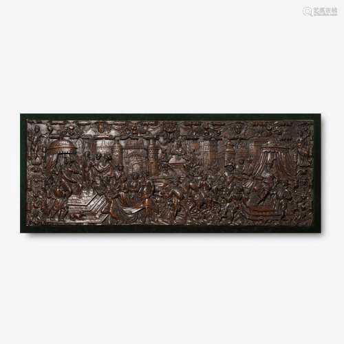 A CARVED OAK PANEL DEPICTING THE BANQUET SCENE FROM PURIM ST...