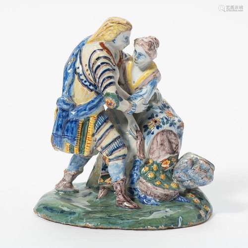 A DUTCH DELFT POLYCHROME FIGURAL GROUP MARKED 'LVE' ...