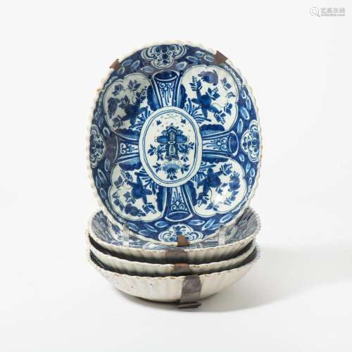A SET OF FOUR DUTCH DELFT BLUE AND WHITE OVAL DISHES 18TH CE...