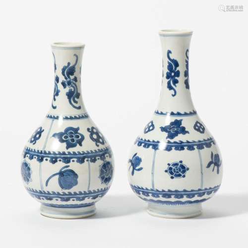 A NEAR PAIR OF CHINESE BLUE AND WHITE BOTTLE VASES KANGXI PE...