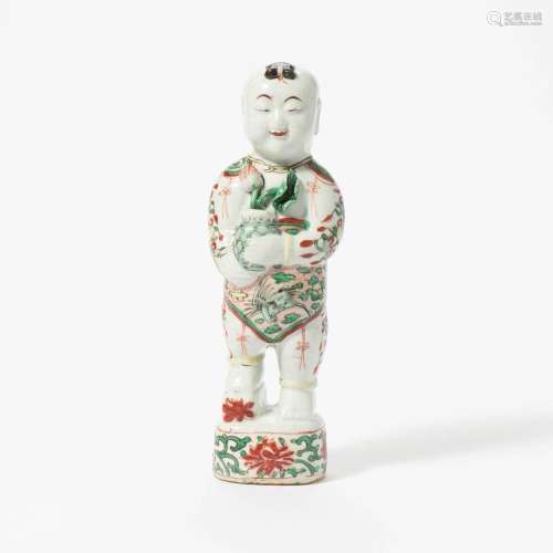 A CHINESE FAMILLE VERTE FIGURE OF A BOY KANGXI PERIOD (1662-...
