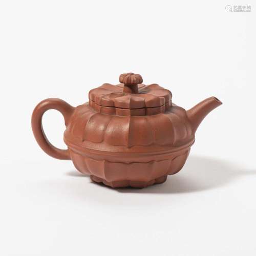 A CHINESE YIXING POTTERY TEAPOT AND COVER PROBABLY QING DYNA...