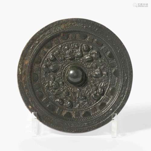 A CHINESE BRONZE MIRROR HAN DYNASTY (206 BC-220 AD)