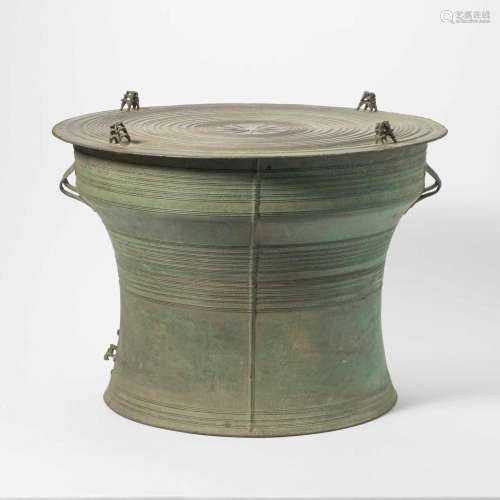 A SOUTHEAST ASIAN BRONZE DRUM THE ROUND DRUM CAST IN RELIEF ...