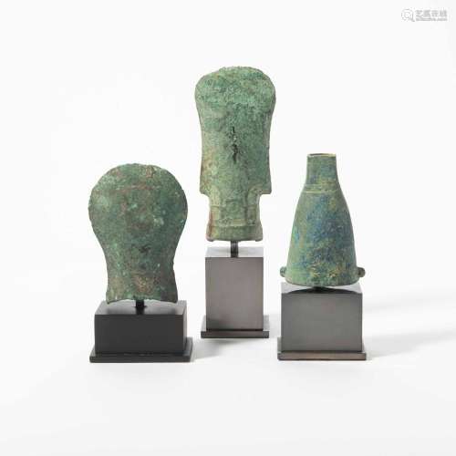 A CHINESE BRONZE AXE-CAP AND TWO AXES THE AXE-CAP HAN DYNAST...