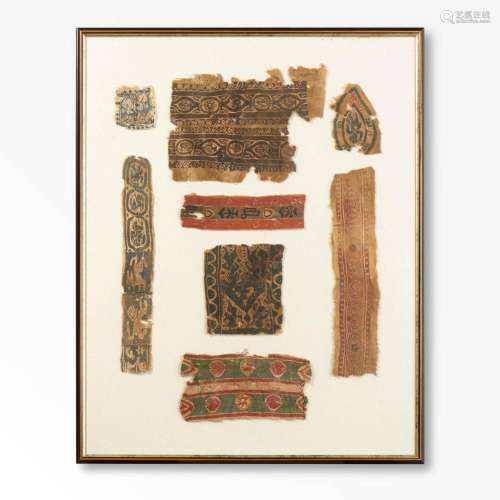 A FRAMED COLLECTION OF 8 VARIOUS COPTIC TEXTILE FRAGMENTS EG...