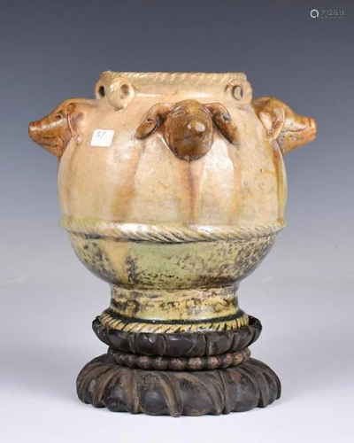 A Pottery Jar With Stand